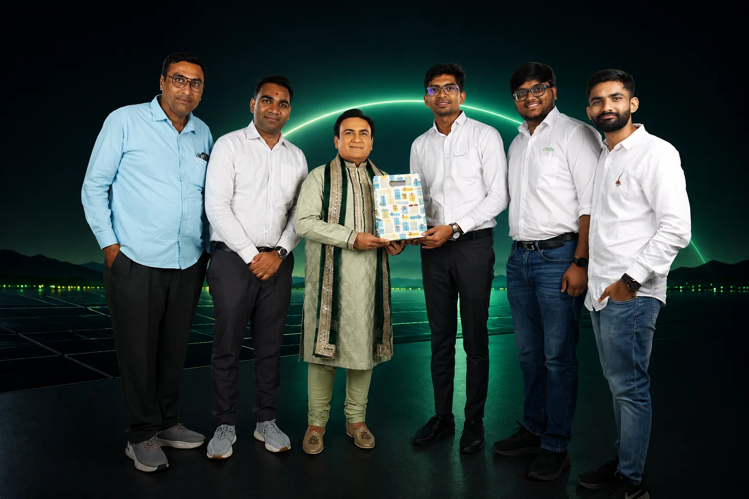 The Qbits Energy team presenting a memento to Dilip Joshi